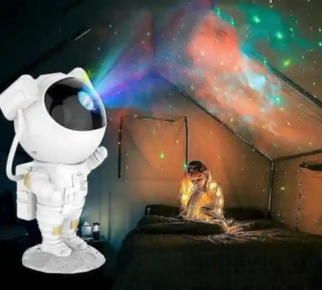 Proiector Laser Astronaut cu Joc de Lumini Aurora Boreala si Stele, Reglare 360, Timer, Setare Luminozitate, Telecomanda